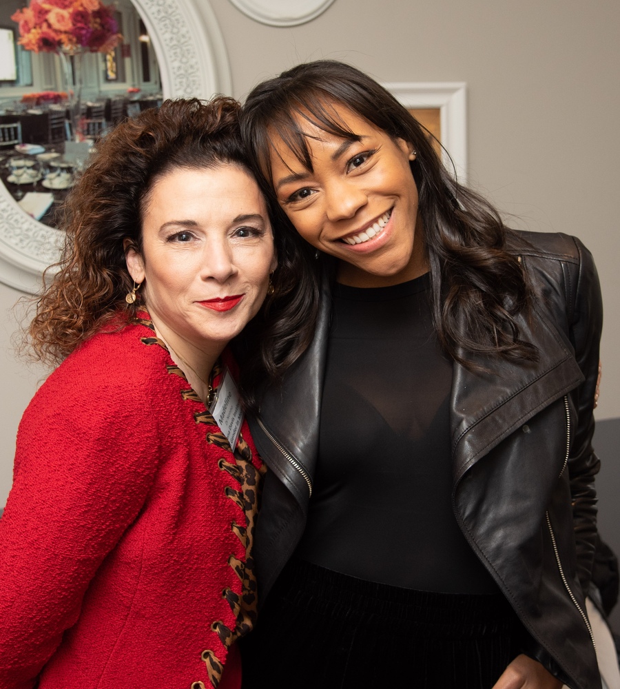 Actor Nikki M. James and Geena Davis Institute CEO Madeline Di Nonno smiling together at the "Check Your Lens: Why Intersectional Media Portrayals Matter" salon event.