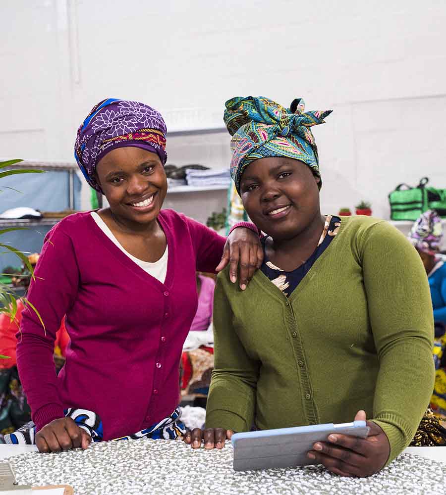 Smiling women working in their own business