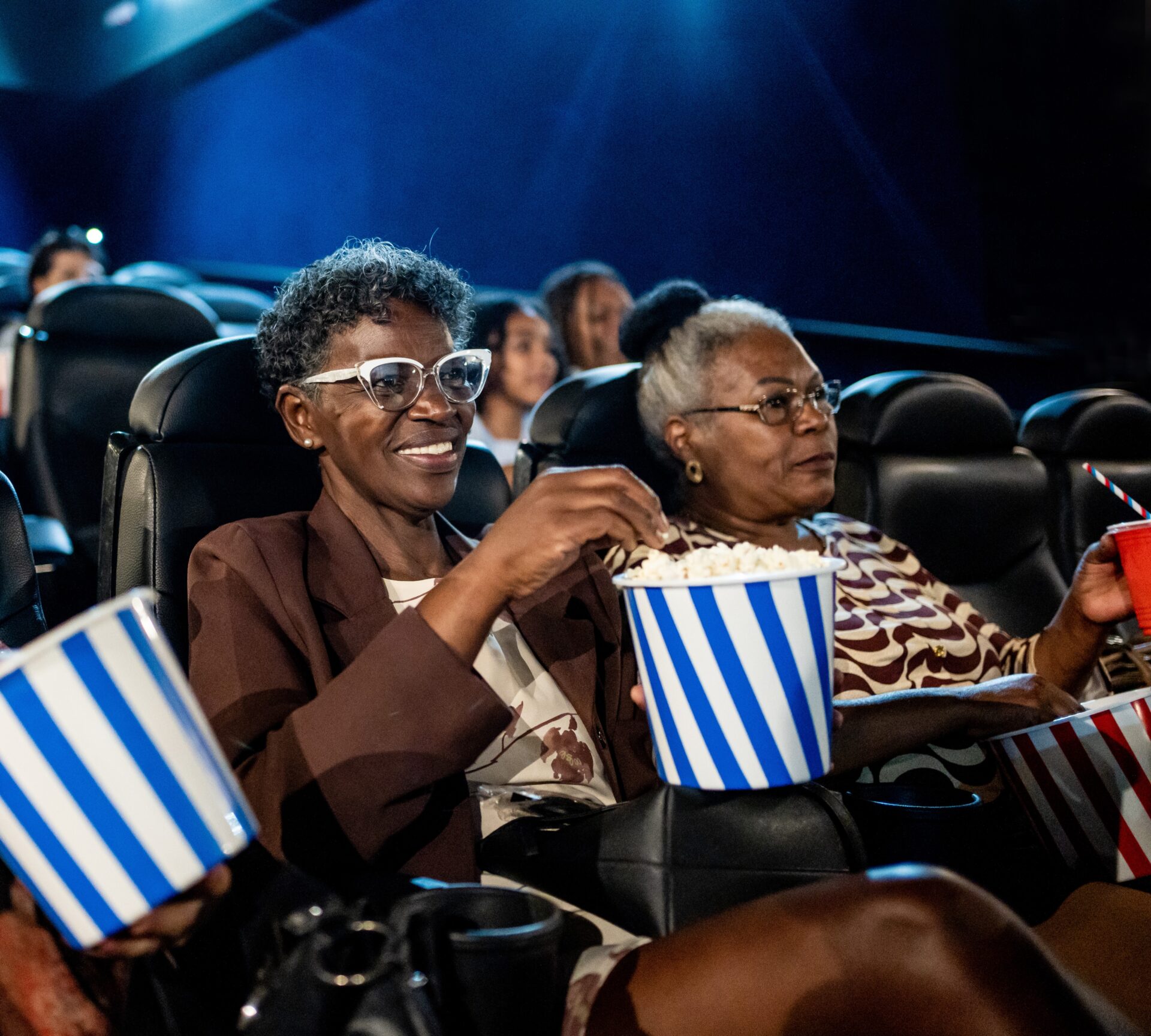Group of happy older women at the cinema