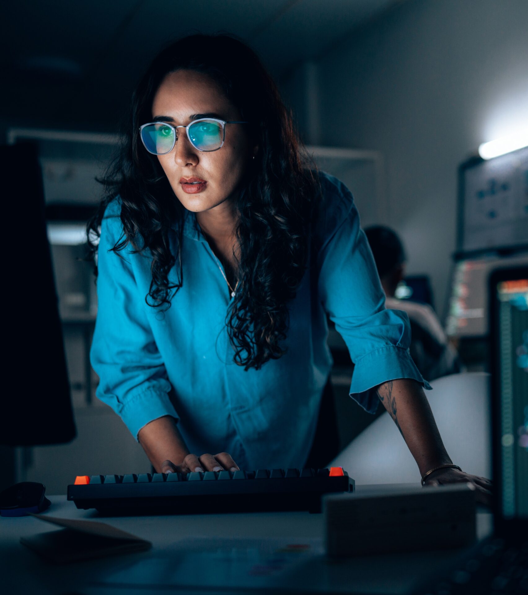 Photo of a woman of color working on a computer