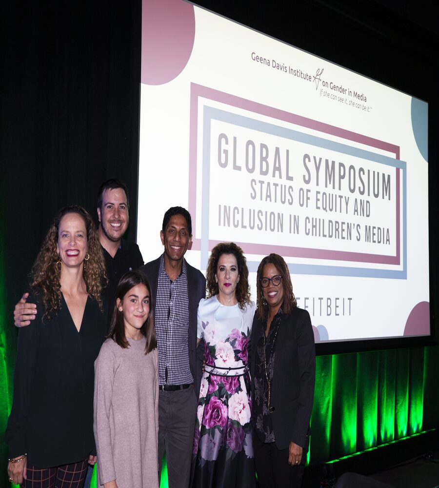 Panelists and speakers pose on stage at the Geena Davis Institute Global Symposium on the Status of Equity and Inclusion in Children’s Media in New York City.