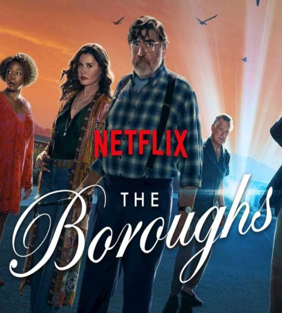 Promotional poster for the Netflix sci-fi series The Boroughs, featuring the ensemble cast including Alfred Molina, Geena Davis, and Alfre Woodard standing on a desert road under a glowing orange sky.