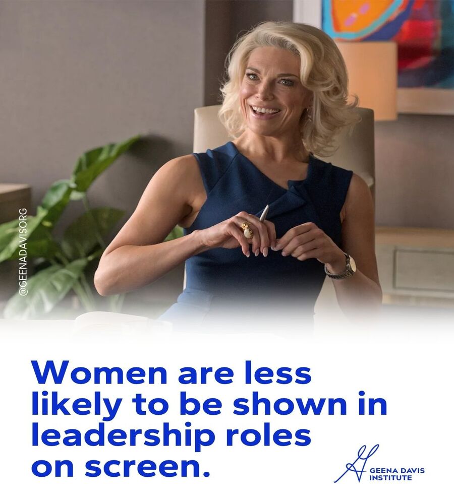 Hannah Waddingham seated in a sleeveless blue top holding a pen and smiling, with text overlay reading 